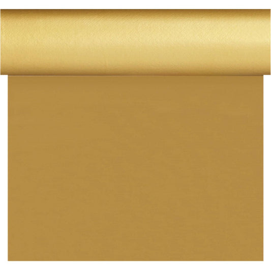 Eine Rolle goldfarbenes Geschenkpapier wird teilweise abgerollt und spiegelt das glatte, glänzende Aussehen und die gleichmäßige Textur der Dunisilk Tete a Tete 0,4x24m gold Tischdecke der Duni GmbH wider.