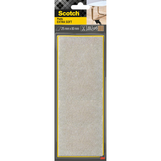 Abgebildet ist eine Packung Scotch® Extra weiche Filzpads, selbsthaftend, beige (215 mm x 80 mm) der 3M Deutschland GmbH in der schwarz-gelben Originalverpackung mit einem Tischbein, auf dem oben rechts ein Pad abgebildet ist.