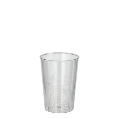 Een glasheldere Starpak 40 drinkbeker (PS, 0,1l, Ø 5,5cm · 7,5cm) staat voor een witte achtergrond. Op de krimpfolie zijn lichte tekstdetails zichtbaar - ideaal voor feestjes en evenementen (40 stuks).