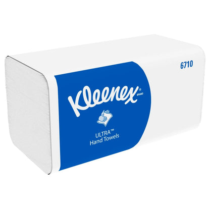 Een rechthoekige doos Kleenex® Ultra™ vouwhanddoeken Interfold, wit, 15 x 96 vellen van Kimberly-Clark GmbH - ideaal voor hygiënisch handen drogen, met blauw etiket, merknaam, handsymbool en productnummer 6710.