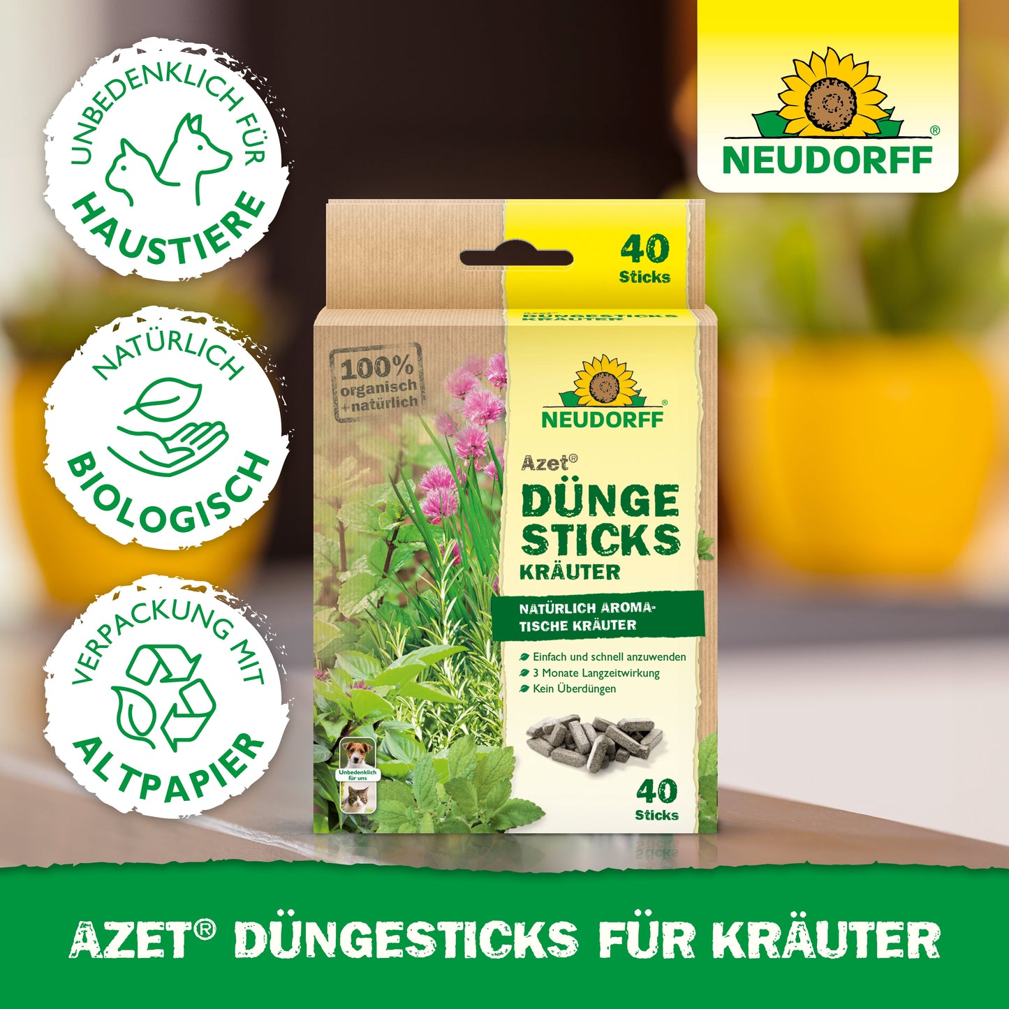 Azet Düngesticks für Kräuter aus dem Neudorff Shop mit 40 Bio-Sticks in tiergerechter, recycelbarer Verpackung sind abgebildet. Das Etikett ist sichtbar, im Hintergrund sind Grünpflanzen und Blumenerde zu sehen.