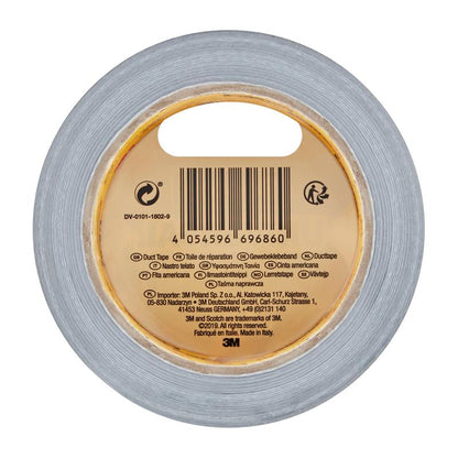 Een rol Scotch® Universal Tape 2904 (25 m x 48 mm) van 3M Deutschland GmbH in bovenaanzicht, met barcode, productgegevens en meertalige opschrift op de binnenste kartonnen kern. Het 3M-logo bevindt zich aan de onderkant van het etiket.