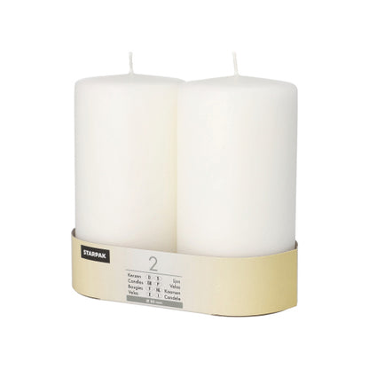 Twee grote, witte Starpak stompkaarsen (Ø 80 mm) met platte top en onbelichte lont staan naast elkaar in een beige en witte Starpak-verpakking.