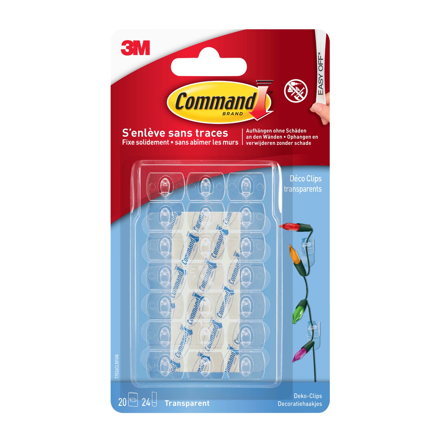 Een verpakking Command™ decoratieclips van 3M Deutschland GmbH, transparant met heldere strips, bevat 20 clips en 24 kleefstrips in een heldere verpakking met rood en blauw merklogo.