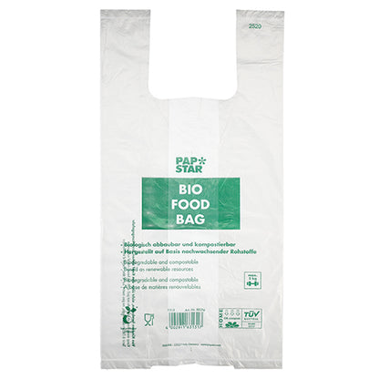 De 100 hemdtasjes van PAPSTAR GmbH zijn transparante, biologisch afbreekbare bio-folie knooptasjes op een rol met groene "PAP STAR BIO FOOD BAG"-tekst en meertalige informatie over composteerbaarheid en hernieuwbare grondstoffen.