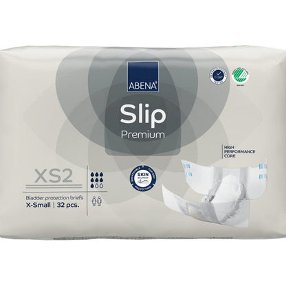 Een 32-pack ABENA Slip Premium van Abena Re-Seller GmbH in de maat XS2 X-Small in beige verpakking met de certificeringen "High Performance Core" en "Skin Friendly" voor betrouwbare incontinentiezorg.