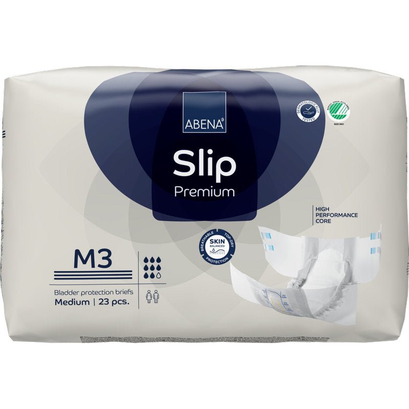 Een verpakking ABENA Slip Premium van Abena Re-Seller GmbH, middelgrote maat, 23 slips. Met krachtige kern en huidvriendelijk ontwerp. De verpakking toont een ongevouwen slip - ideaal voor betrouwbare incontinentiezorg.