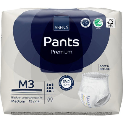 Een verpakking ABENA Pants Premium M van Abena Re-Seller GmbH, medium maat, 15 stuks. De verpakking benadrukt de huidbescherming, zachtheid, veiligheid en milieuvriendelijke certificering. Bevat een afbeelding van de wegwerpboksershort.