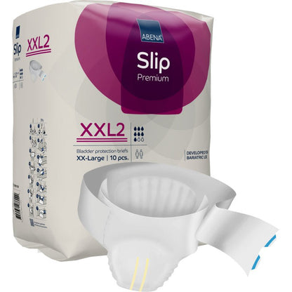 Een verpakking ABENA Slip Premium van Abena Re-Seller GmbH is tentoongesteld, een deels uitgepakte slip ligt ervoor. De paars-witte verpakking benadrukt de maat XX-Large, 10 stuks, en de betrouwbare incontinentiezorg.
