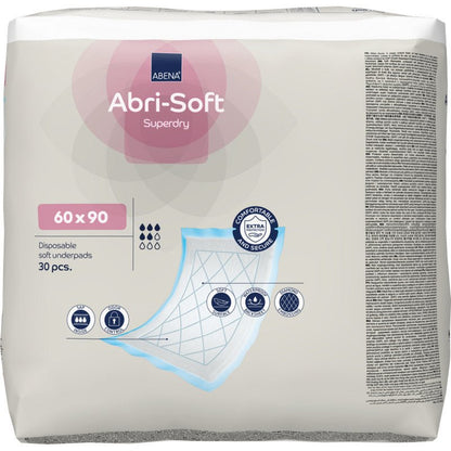 Een verpakking met 30 stuks Abena Re-Seller GmbH wegwerp-onderlegger, Abri-Soft Superdry, Blauw (60 x 90 cm) bevat een geïllustreerde verpakking met de productkenmerken en een schema van de lagen van de onderlegger.