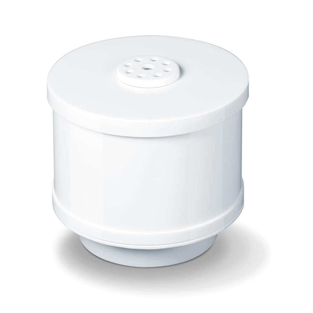 Een cilindrische witte Beurer LB 44, LB 45, LB 88 kalkfilter van Beurer GmbH ligt op een wit oppervlak. Het filter heeft een geperforeerde bovenzijde en een gladde buitenkant met een iets bredere basis en bovenzijde, waardoor in het midden een subtiele uitstulping ontstaat.