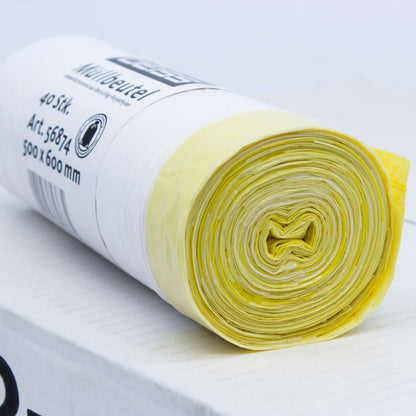 Een opgerolde verpakking DEISS Vuilniszakken 56874 30 liter met trekband van EMIL DEISS KG (GmbH + Co.), met gele en witte plastic vuilniszakken op een witte ondergrond. Het etiket op de rol vermeldt de afmetingen 500 x 600 mm en geeft aan dat ze 40 stuks met een inhoud van elk 30 liter bevat.