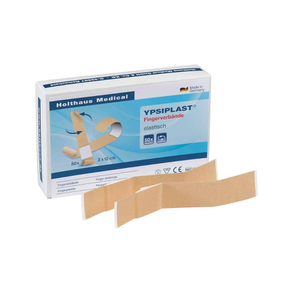 Tentoongesteld is een doosje Holthaus Medical YPSIPLAST® vingerverband, elastisch van Holthaus Medical GmbH & Co. KG, die 50 elastische verbanden met de afmetingen 2 cm x 12 cm bevat. Voor de doos zijn twee elastische vingerverbanden geplaatst. Op de verpakking staat trots 'Made in Germany'.