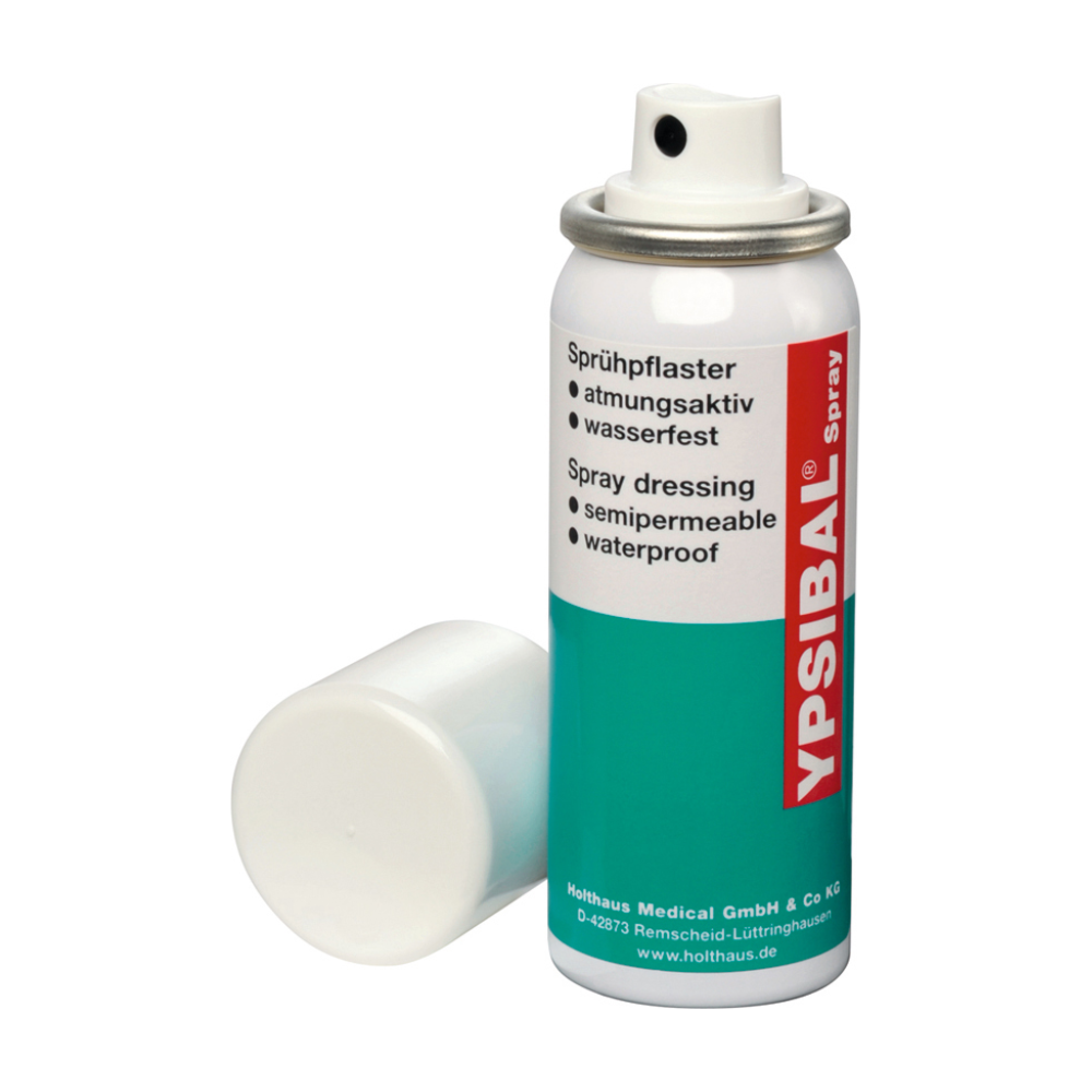 Een spuitbus Holthaus Ypsibal® Spray, pleister in sprayvorm - 50 ml van Holthaus Medical GmbH & Co. KG wordt zonder witte dop getoond en leunt tegen de basis. De tekst op de overwegend witte bus met blauwgroene secties en rode accenten geeft aan dat het een halfdoorlatend, waterdicht, ademend spuitverband voor snij- en schaafwonden is.