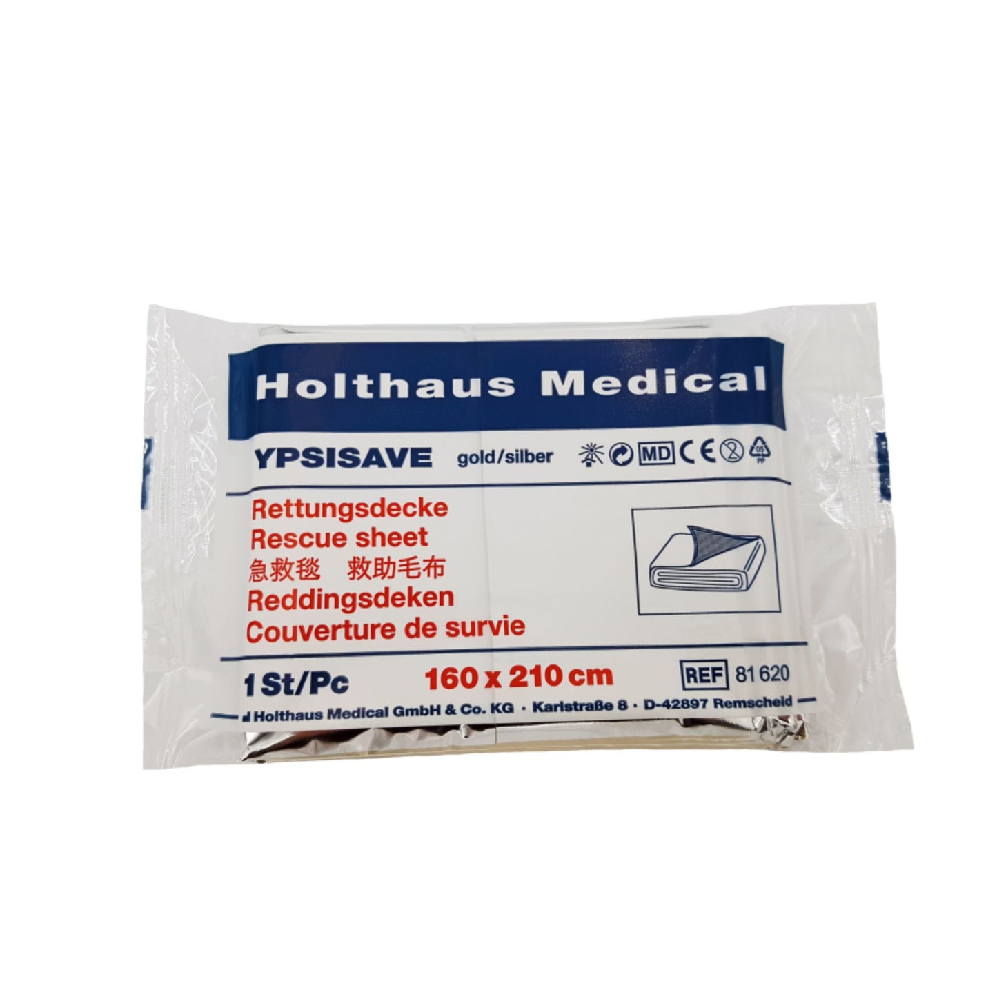 De verpakking van de Holthaus Medical YPSISAVE reddingsdeken goud/zilver (160 x 210 cm) biedt bescherming tegen kou, is meertalig geëtiketteerd en toont prominent de merknaam Holthaus Medical GmbH & Co. KG evenals het referentienummer 61620.