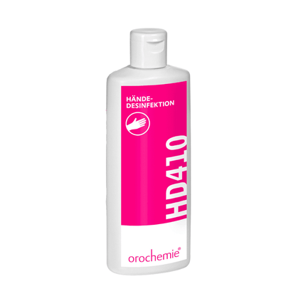 De witte kunststof fles met het roze etiket "Orochemie HD 410 Handdesinfectie" van orochemie GmbH + Co KG, een alcoholisch wrijfpreparaat voor handdesinfectie, heeft een praktische flip-top sluiting.