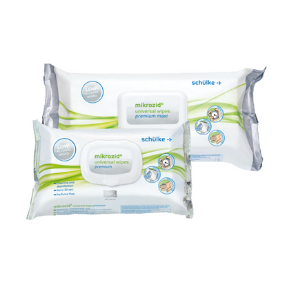 Tentoongesteld zijn twee verpakkingen Schülke Mikrozid® universal wipes desinfectiedoekjes premium van Schülke & Mayr GmbH. Eén draagt de opdruk 'premium maxi', de andere alleen 'premium'. Beide zijn overwegend wit-groen ontworpen, met aanwijzingen en symbolen voor gebruik op de verpakking voor de snelle desinfectie met alcoholische desinfectiedoekjes.