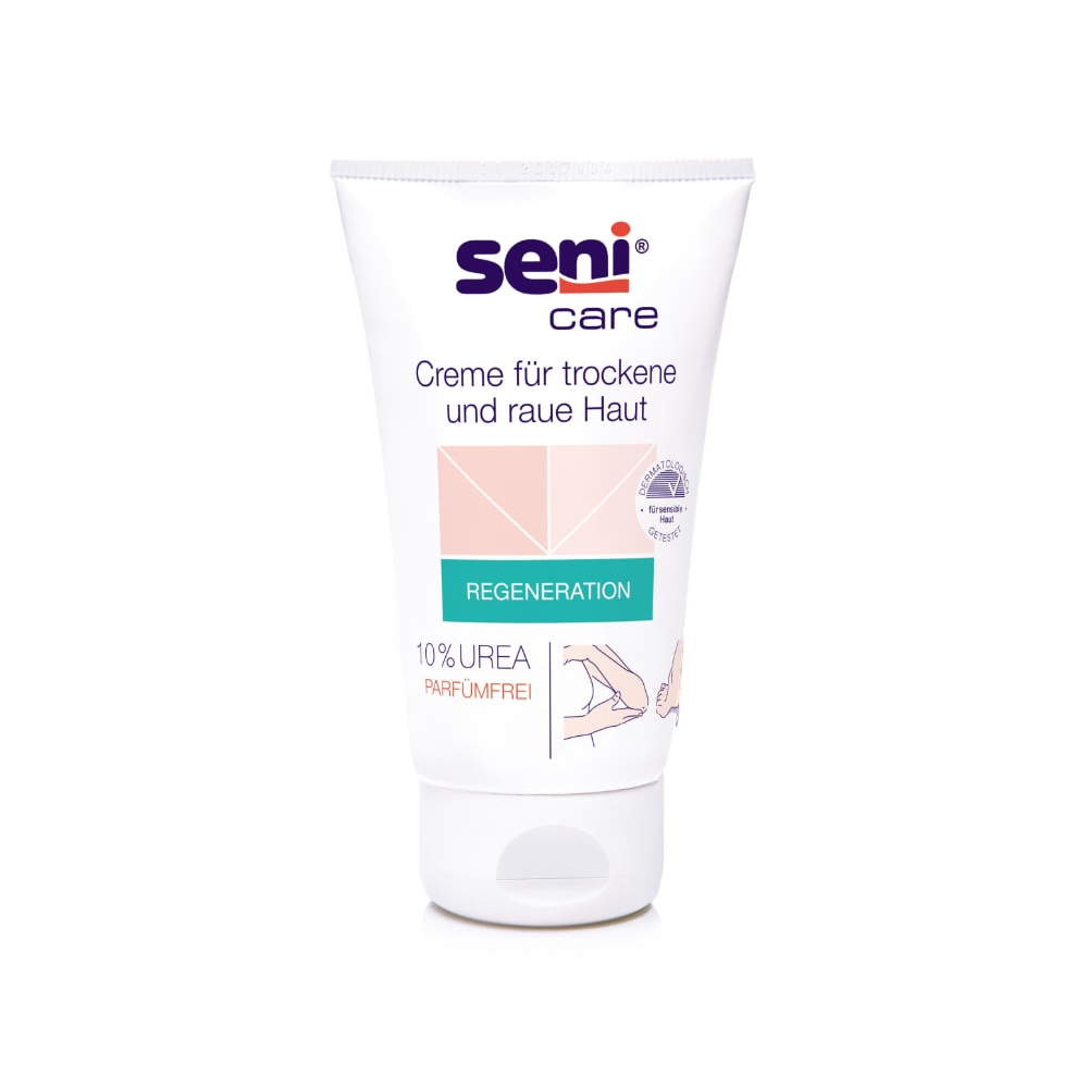 Een tube van 100 ml Seni Care Crème van TZMO Deutschland GmbH voor droge en ruwe huid heeft een witte achtergrond met lichtroze en groene accenten. Het etiket wijst op 10% ureum, is parfumvrij, verhoogt het vochtgehalte en bevat een Duitse gebruiksaanwijzing.