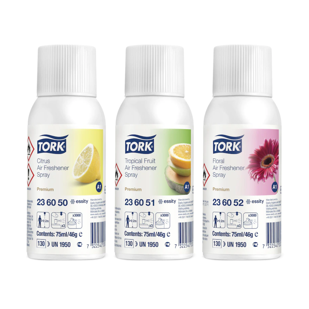 Drie Tork 236056 luchtverfrissersprays in een gemengd pakket (Citrus, Tropisch Fruit, Bloemig) met bijpassende motieven op wit etiket - ideaal voor geurneutralisatie en langdurige frisheid. Doos bevat 12 flessen.