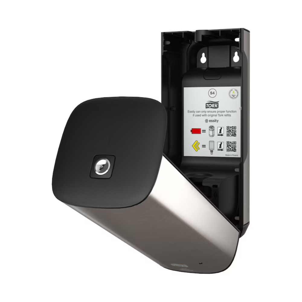 Der Tork 460009 Hautpflege Spender von TORK – Essity Professional Hygiene Germany GmbH wird offen präsentiert und verfügt über ein stilvolles, modernes Design mit metallischer Oberfläche und schwarzer Frontplatte. Im Inneren sind Bedienungsanleitungen und QR-Codes sichtbar. Dieser wandmontierte Spender aus Edelstahl ist für eine effiziente Handtuchnutzung konzipiert und verfügt über eine innovative Intuition Sensor-Technologie.