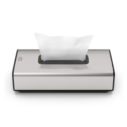 Wij presenteren de Tork 460013 dispenser voor cosmetische tissues Image Line F1 van Essity Professional Hygiene Germany GmbH. Deze elegante zilveren tissue-dispenser valt op door een modern rechthoekig ontwerp met een roestvrijstalen afwerking. Hij beschikt over een functie voor het uitnemen van enkele vellen, waarmee een wit tissue gedeeltelijk uit de bovenste opening kan worden getrokken, en zijn minimalistische uiterlijk maakt hem ideaal voor cosmetische tissues.