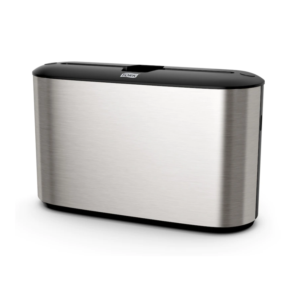 Erleben Sie das elegante Design des Tork Xpress® 460005 Tischspenders für Multifold-Handtücher, Teil der Image Line H2-Kollektion. Dieser Spender von TORK – Essity Professional Hygiene Germany GmbH hat eine schlanke, rechteckige Form mit einer schwarzen Oberseite und einer glatten, reflektierenden Oberfläche. Sein minimalistischer Stil ergänzt nahtlos einen ultramodernen Raum und passt perfekt zu anderen Tork Xpress-Accessoires.