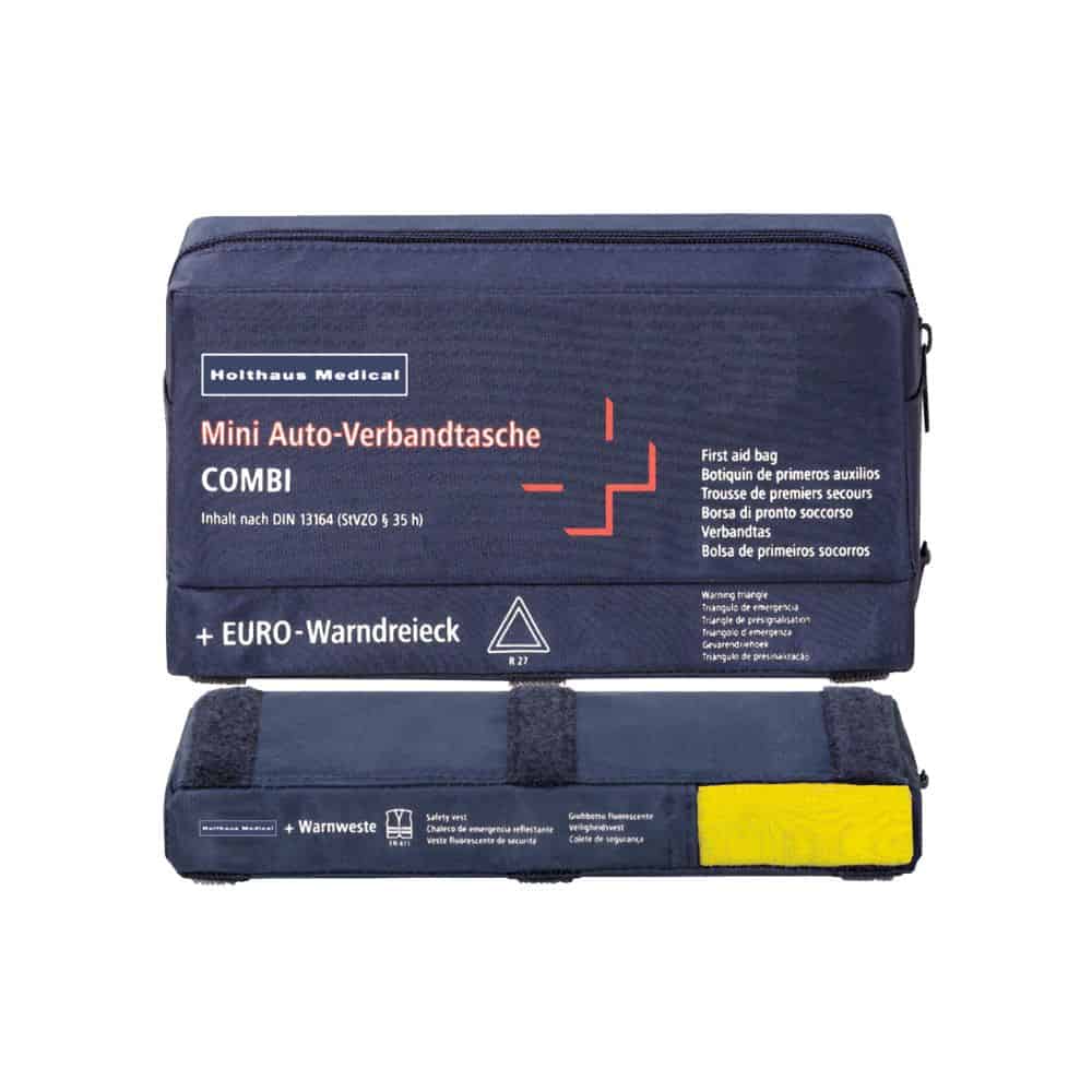 Een mini-verbandtas COMBI Auto van Holthaus Medical GmbH & Co. KG is in blauw gehouden en toont meertalig beschreven inhoud. Deze EHBO-set bevat een veiligheidsvest en een gevarendriehoek, waarbij het gele vest duidelijk zichtbaar onderaan te zien is.