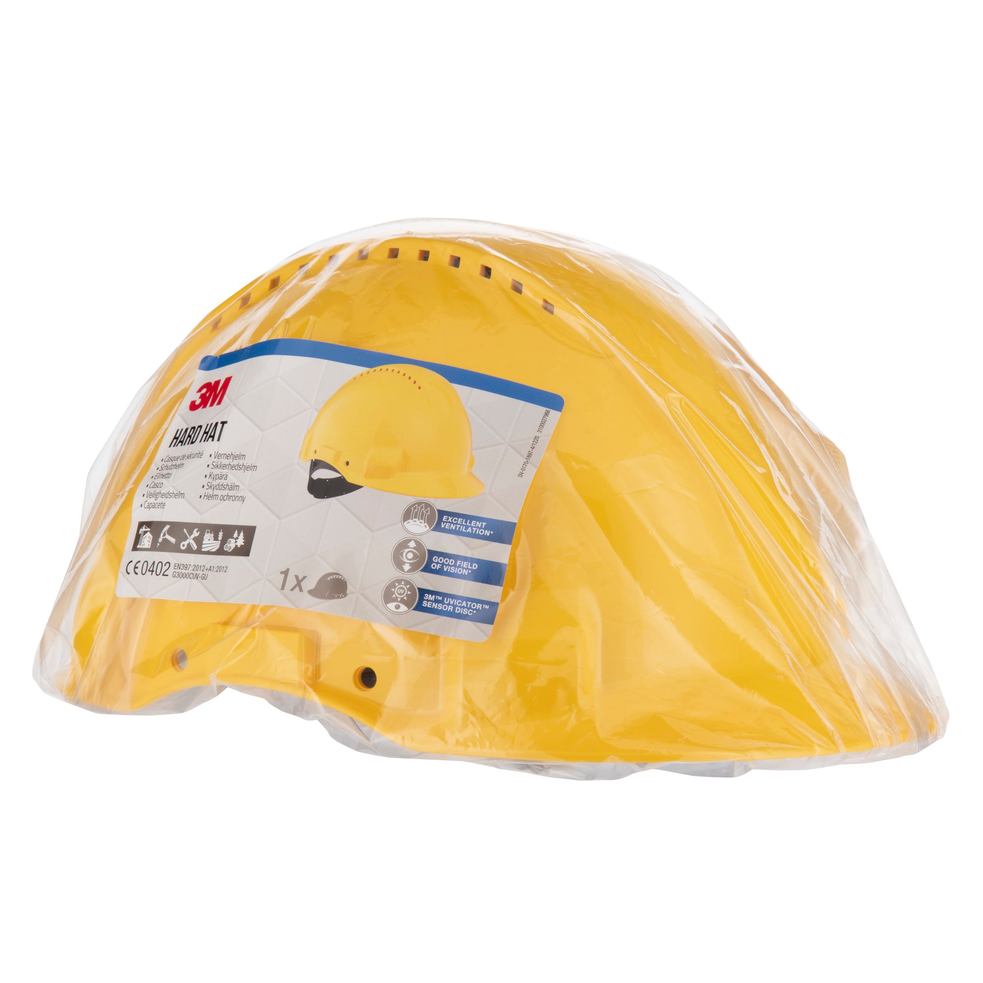 Ein gelber 3M™ Schutzhelm G3000C Uvicator der 3M Deutschland GmbH befindet sich in einer durchsichtigen Kunststoffverpackung mit einem Frontetikett mit Produktinformationen, einer Helmabbildung und Sicherheitszertifikaten.