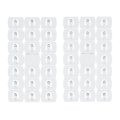 Twee verpakkingen met 24 Command™ decoratieclips, transparant met transparante strips, van 3M Deutschland GmbH, weergegeven in een rasterpatroon op witte achtergrond.